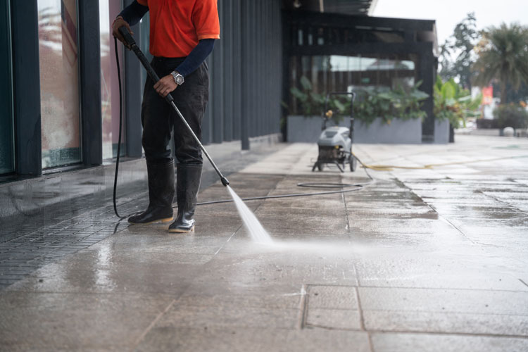 camco staff pressure washing at a shopping centre
